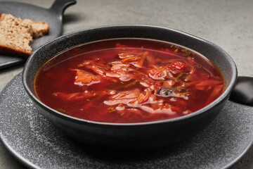 Ayurvedic borscht in a stone bowl close-up.
