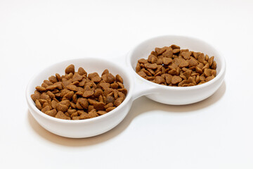 cat food in a white bowl on a white background