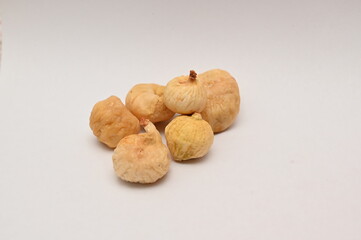 Mini dried figs on isolated white background