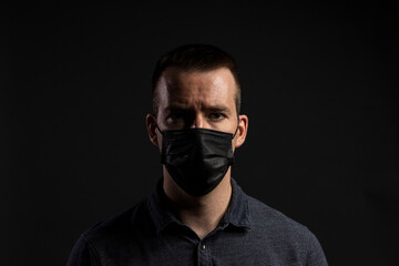 Man Wearing Face Mask Looking Forward