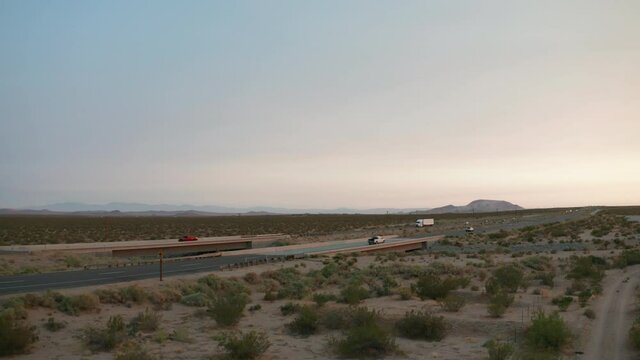 Truck transporting a heavy payload through the Mojave Desert - aerial view