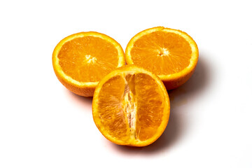 Rough cut sliced orange fruit on white background