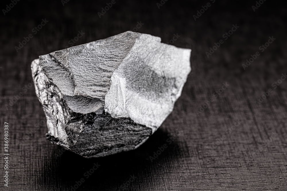 Poster iron ore stones, on isolated black background, used in industry, Chinese iron ore for export and import.