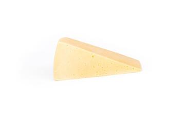 Shooting in the studio. A piece of yellow cheese, cut from the head. Close-up. On white background.