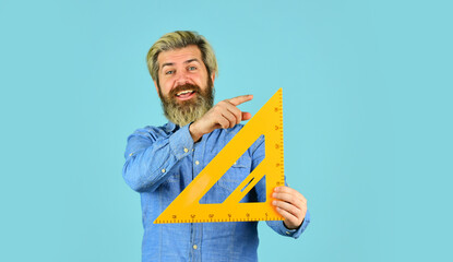 Drawing lesson. Studying with fun. Right angle. Measurement tool. Teacher stem. School education. Find perfect angle. Architect education. Teaching geometry. Bearded man use ruler. Education concept