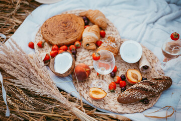 happy friends in a wheat field. girls on a picnic in a field at sunset.