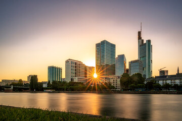Frankfurt in Germany, a great city with many old houses and skyscrapers. Sunset or sunrise photo with reflections in puddles, beautiful urban street images