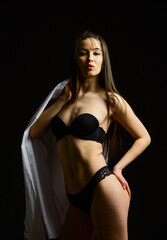 Fototapeta premium Shirtless beauty. female lingerie style. erotic games and desire. sensual girl in morning. perfect body shapes. seducing you. sexy girl undressing. woman wear male white shirt. fashion and beauty
