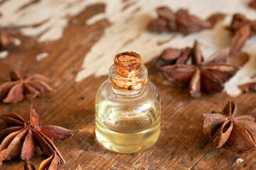 A bottle of essential oil with star anise