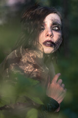 Portrait of young beautiful woman with Halloween professional makeup