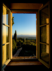 Looking out a window onto the Tuscan landscape