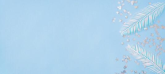 Flat lay frame with christmas decorationon a blue background