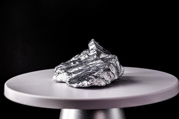 aluminum stones on electronic scale. Metal used in industry. Mineral extraction concept.