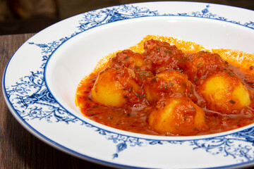 Homemade Italian potato gnocchi with tomato sauce