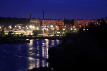 Fototapeta na wymiar River on the outskirts of the city in Eastern Europe in the evening