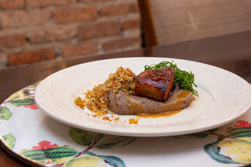 Fried bean with crunchy bacon, ground banana and cabbage