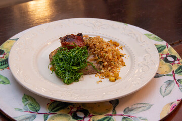 Fried bean with crunchy bacon, ground banana and cabbage