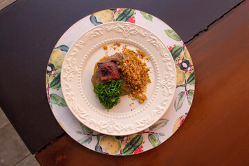 Fried bean with crunchy bacon, ground banana and cabbage