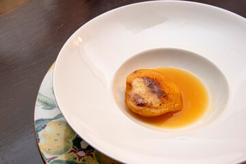 Dessert of pear brulee with dolce gorgonzola cheese