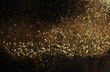 Gold (bronze) glitter shine dots confetti on black. Abstract light blink sparkle horizontal backgound.