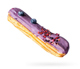Delicious eclair with blueberries close-up isolated on a white background
