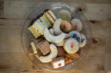 Group of delicious sweet Christmas cookies, white vanilla rolls, gingerbread, linzer and chocolate sweets wiht jam filling