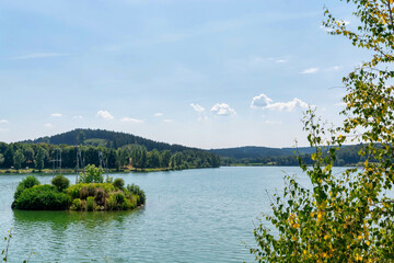 Spring landscape with tranquil lake and trees
