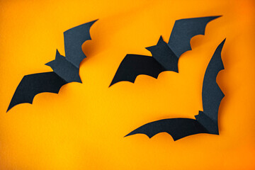Fototapeta premium The composition decor for Halloween holiday. Halloween decorations on orange background. Halloween concept. Halloween holiday decorations
