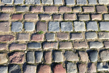Stone pavement. Paving from paving stones of different colors.