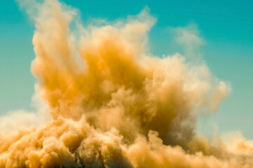 Dust storm after detonator blast in the desert 