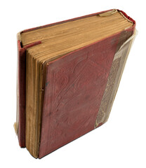 High angle view of weathered old quran book, isolated on white background. Focus stacking shot. Textured red hardcover.