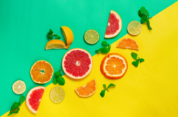 assortment of citrus fruits, on a yellow green background, top view, no people, horizontal