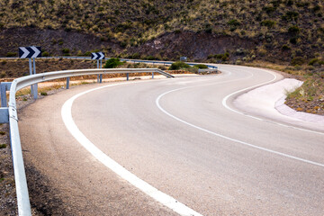 A dangerous and curvy two-lane asphalt road on the mountains near Cabo de Gata-Níjar Natural Park in the southeastern corner of Spain