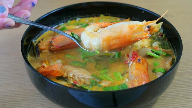 Hot and Spicy Tom-Yum Goong soup with shrimp River prawn , spicy soup traditional Thai food cuisine is the most popular 