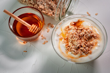 Oats with yogurt and honey on a table