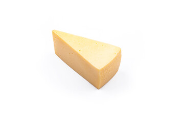 Shooting in the studio. A piece of yellow cheese, cut from the head. Close-up. On white background.