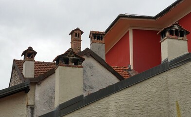 Rooftops and chimneys in the center of Lugano. The old houses in the city center are used for residential purposes. 