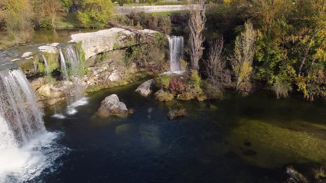 Aerial view of a scenic waterfall in Pedrosa de Tobalina, Burgos, Spain. High quality 4k footage