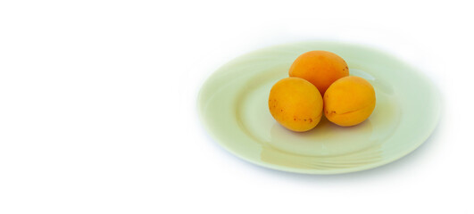 THREE peach, ON A WHITE CERAMIC PLATE AND ON A WHITE BACKGROUND. healthy food concept.copyspace for text.
