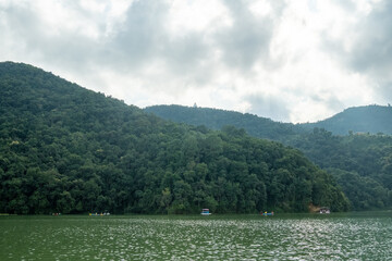 View from Lake Phewa, in Pokhara (Nepal), on the banks of the Anadu hill and the Shanti stupa (Peace Pagoda) on it