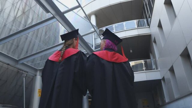 Two graduate students are walking through the University