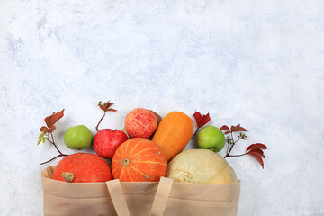 Healthy natural food in eco bag, healthy lifestyle concept, zero waste. Thanksgiving food delivery, donation, coronavirus quarantine. Pumpkins, apples, zucchini in cloth packaging, autumn shopping