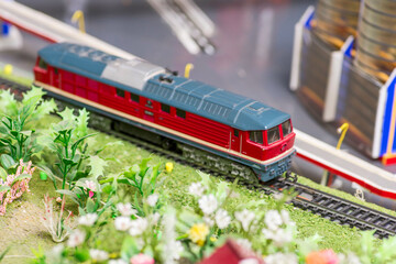 Railway modelling. Close-up about model train on the rail tracks