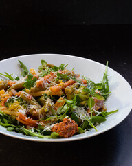 Rucola with  caserecce tricolor, pasta with broccoli, red pesto