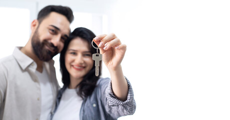 Portrait of young couple happy to buy a new home.