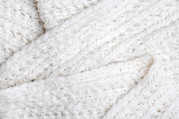 White knitted texture and background, close up.