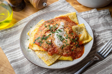 beef bolognese ravioli with tomato sauce