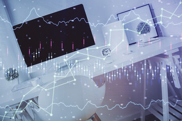 Double exposure of financial graph drawing and office interior background. Concept of stock market.
