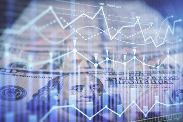 Double exposure of forex graph drawing over us dollars bill background. Concept of financial markets.