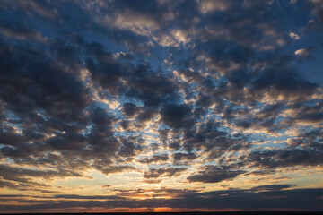 Beautiful atmospheric dramatic clouds in the evening at sunset.